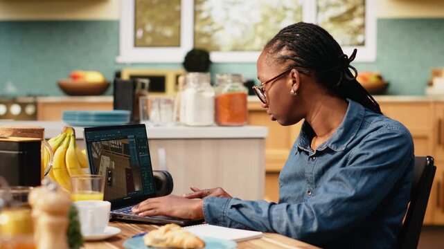 Black woman contractor remodeling floor plan and blueprints