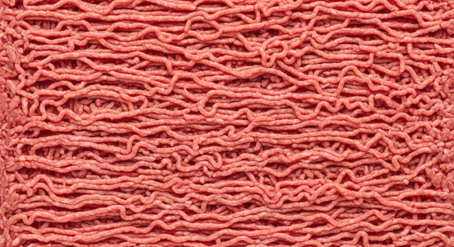 Raw ground meat texture background showing fresh red beef mince arranged in horizontal lines for culinary and cooking projects