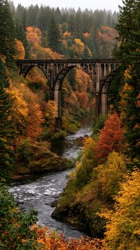 a serene autumn landscape features a majestic stone viaduct spanning a river. The bridges arches and pillars are intricately designed, showcasing the intricate details of the stonework.