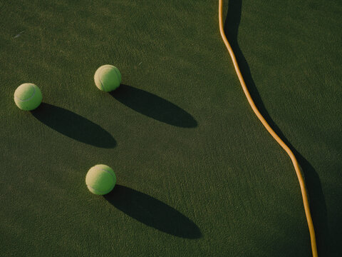 Tennis balls on court