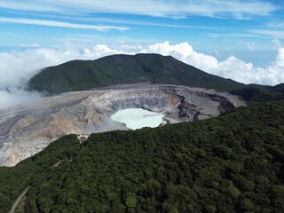 Poas Volcano crater with pale turquoise lake and green forest, Costa Rica © SergioEduardo
