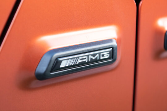 Miami, Florida, USA - July 27, 2025: Mercedes Benz AMG G 63 2022 SUV or wagon car. SUV Mercedes Benz AMG G 63. Car Mercedes Benz AMG G 63 parked outdoor. Orange matte car, logo sign.
