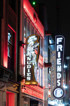 Nashville, Tennessee, USA - January 22, 2026: Friends in Low Places Bar and Honky Tonk bar neon light. Logo of trademark brand of Friends in Low Places. Logotype of Nudies bar
