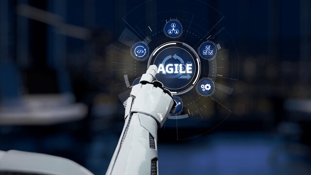 A futuristic robot hand interacts with a sleek digital interface, emphasizing agile methodology within a modern workspace, representing innovation and technology. Synapse