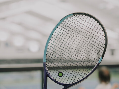 tennis racket with broken string