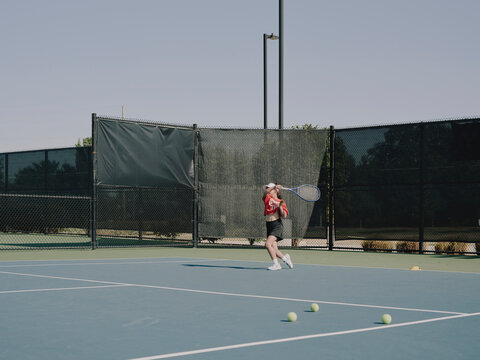 tennis player swinging racket