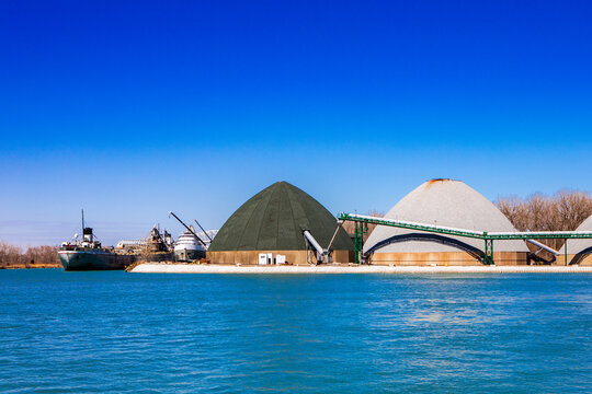 Industrial Bulk Storage Silos and Cargo Ship on Great Lakes Waterfront