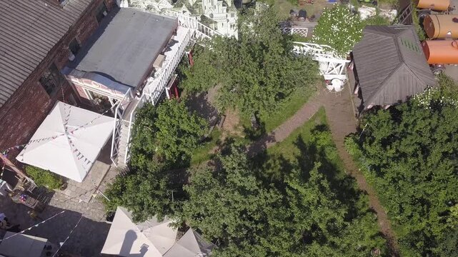 Drone rotates above confectionery courtyard garden