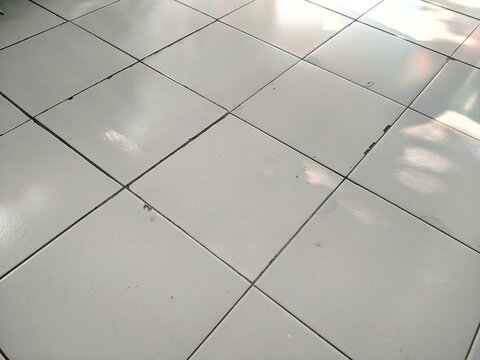 High angle view of white ceramic floor tiles texture background