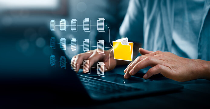 Digital document management concept with professional using laptop and virtual file network showing folder organization, paperless workflow, data storage and business document system