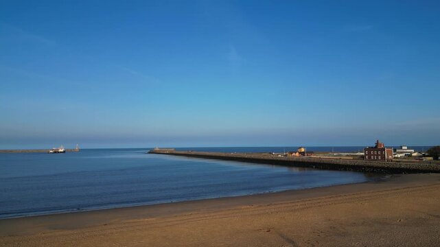 High Angle Drone Camera Footage of Newcastle upon Tyne Beach and Ocean. Newcastle is Cathedral city and metropolitan borough in Tyne and Wear, England, Great Britain.