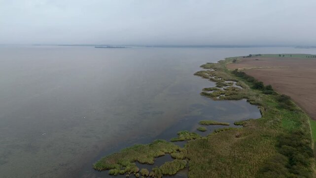 Misty Lagoon and Reed Islands on the Ruegen Coast Aerial View