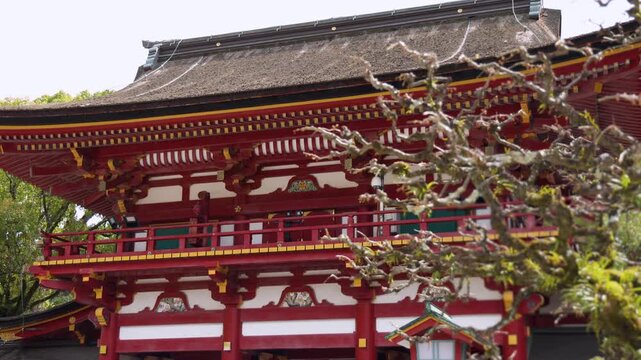 Dazaifu Tenmangu shrine complex in Dazaifu City, Fukuoka Prefecture, Roumon gate main entrance with gardens and nearby temples, Kyushu Island, Japan, red and white traditional Japanese architecture 