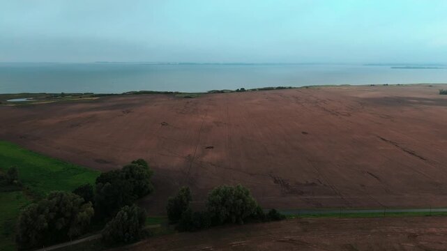 Plowed Field and Willow Trees Above the Ruegen Coast Aerial View