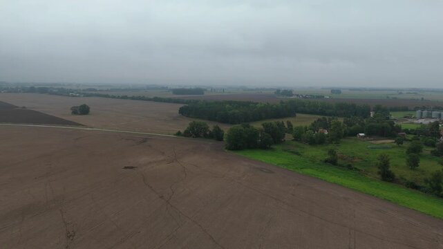 Plowed Fields and Treeline in Haze on Ruegen Island Aerial View