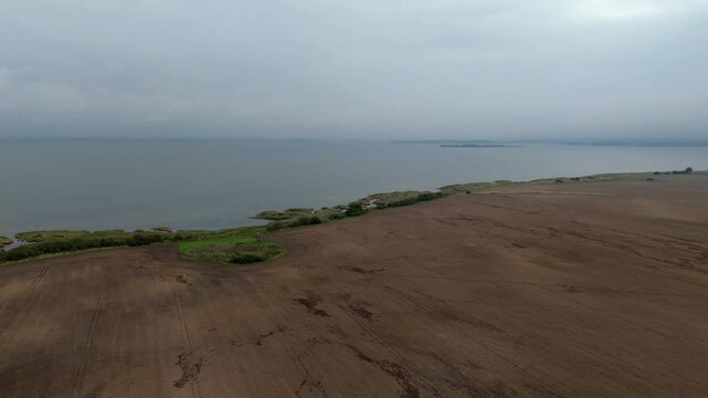 Farmland Meeting a Reed Fringed Lagoon Shore Ruegen Aerial View