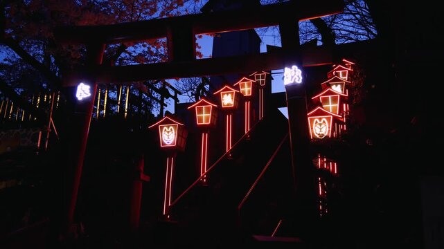 Nakatsukasa Magotaro Inari cyber shrine, Nishi Park, Chuo Ward, Fukuoka City, illuminated staircase with neon lit fox lanterns at night, Kyushu island, Japan, torii gate with cherry blossoms