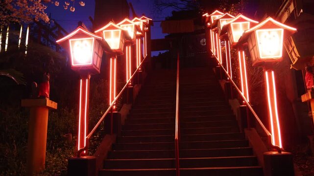Nakatsukasa Magotaro Inari cyber shrine, Nishi Park, Chuo Ward, Fukuoka City, illuminated staircase with neon lit fox lanterns at night, Kyushu island, Japan, torii gate with cherry blossoms