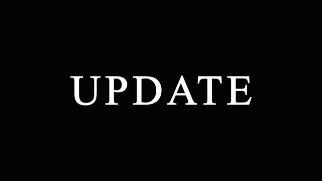 Minimalist white serif update text flickering and dissolving into glowing particles on black.