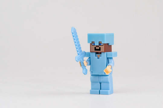 Minecraft Steve toy figure wearing diamond armor and holding pixel sword on white background on Sep 20, 2026 in Jakarta, Indonesia