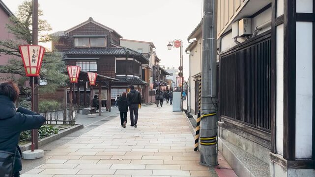 Couple Walking Through Historic Higashi Chaya District in Kanazawa Japan
