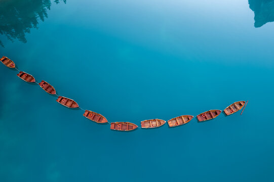 Chain of moored rowing boats from above, Lago di Braies