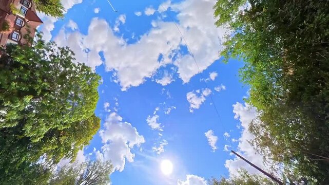 Time Lapse Footage of Sky and Dramatic Clouds over England During Car Drive. Car Roof Mounted Footage with Straight Up Position