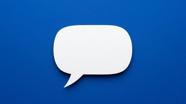 An isolated white speech bubble stands out against a bright blue backdrop providing a clear area for adding text or unique creative