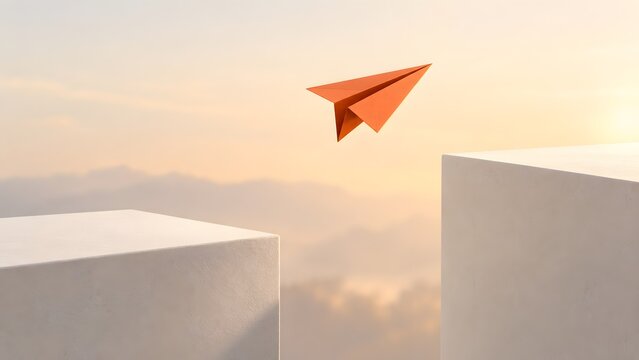 Orange origami paper airplane crossing a gap between two white structural blocks illustrating risk management overcoming obstacles and business progress