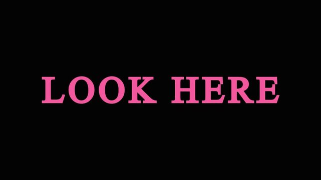 Look here text overlay with blinking colorful glitter particles animation on black screen background.