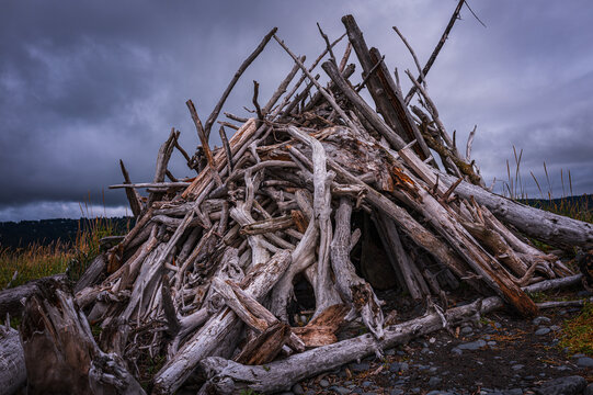 Driftwood beach shelter on Homer Spit bay harbor in Alaska, United States