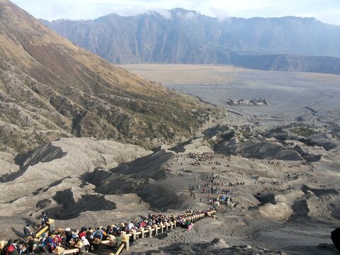 Mount Bromo Volcanic Caldera Landscape with Tourists in East Java Indonesia