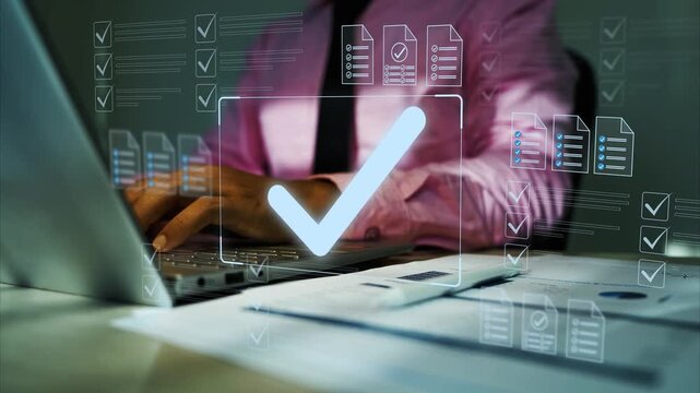 Business professional using a laptop with digital checklist, document approval icons and glowing check mark for online compliance and workflow, Digital holographic checklist approval on laptop