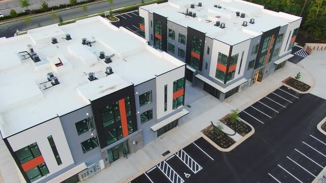 Aerial Forward View of Modern Commercial Office Buildings and TPO Flat Roofs