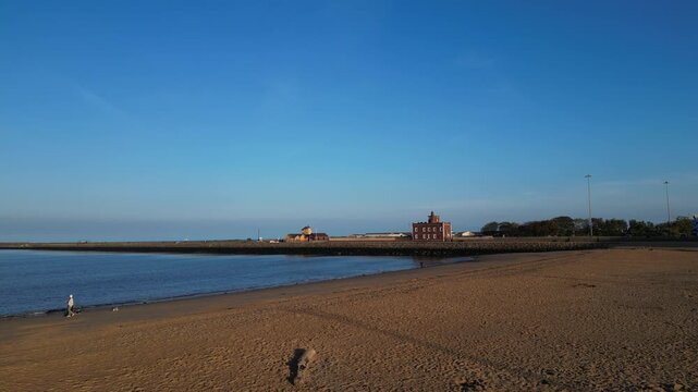 High Angle Drone Camera Footage of Newcastle upon Tyne Beach and Ocean. The Footage Was Captured at Just Before Sunset From Medium High Altitude From Sea Level on 13th October, 2025. 