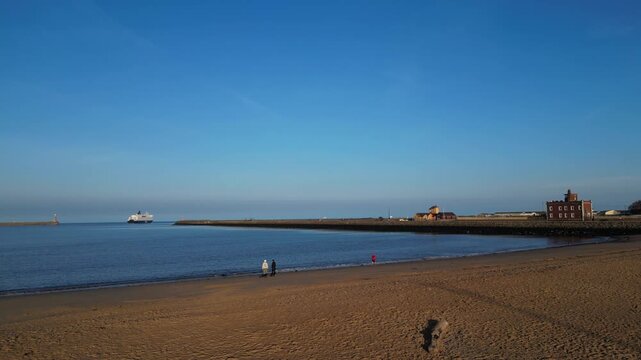 High Angle Drone Camera Footage of Newcastle upon Tyne Beach and Ocean. The Footage Was Captured at Just Before Sunset From Medium High Altitude From Sea Level on 13th October, 2025. 