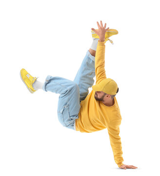 Handsome young man dancing hip-hop on white background