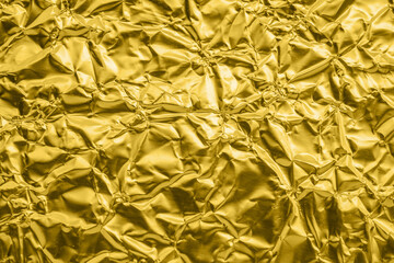 Obraz premium Luxury shiny metallic golden foil crumpled texture background
