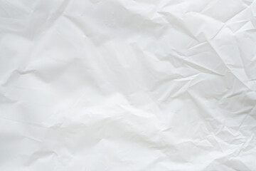 Fototapeta premium Crumpled white plastic bag texture, wrinkled polyethylene film background
