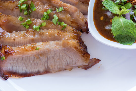 Authentic Thai Grilled Pork Neck Served with Spicy Jaew Dipping Sauce