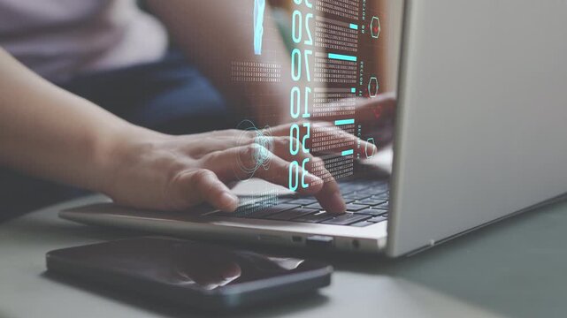 Hands typing on laptop with digital data interface,  cybersecurity, software development, data processing, programming and secure information technology for modern online business.