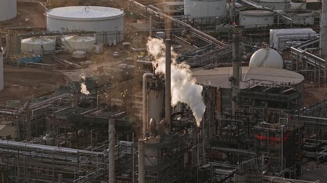 Refinery factory close-up with chimney steam coming out drone video Denver Colorado 4K