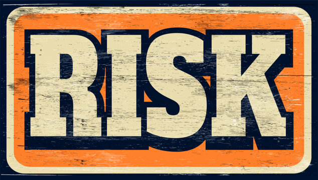 Aged retro risk sign on wood