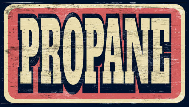 Aged and worn propane sign on wood