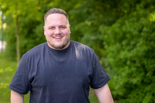 Cheerful Young Man Smiling Outdoors