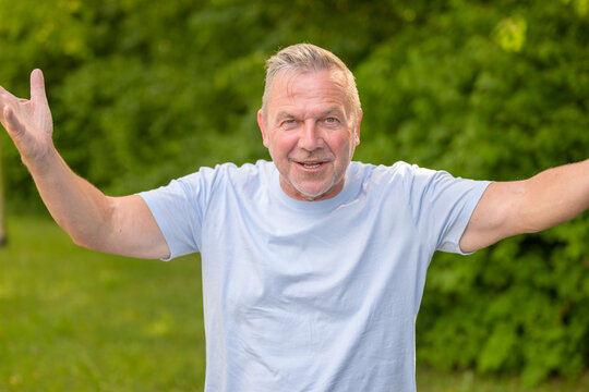 Cheerful Senior Man Welcoming Everyone