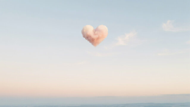 Delicate heart cloud in a soft pastel sky with subtle pink and blue hues
