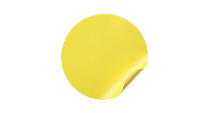 Blank yellow round sticker label with peeled corner isolated on a white background template