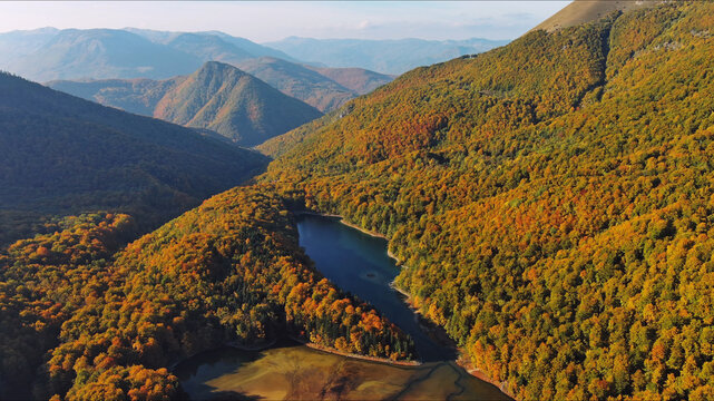 Biogradsko lake in mountain valley with bright colors autumn forest