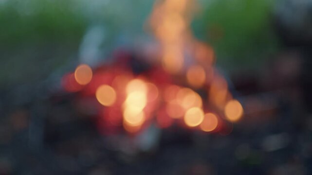 Bonfire burns outdoor, naturally blurred footage of the bonfire